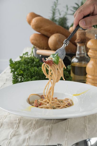 Spaghetti bolognese on fork with vegetables, italian food - Photo, Image