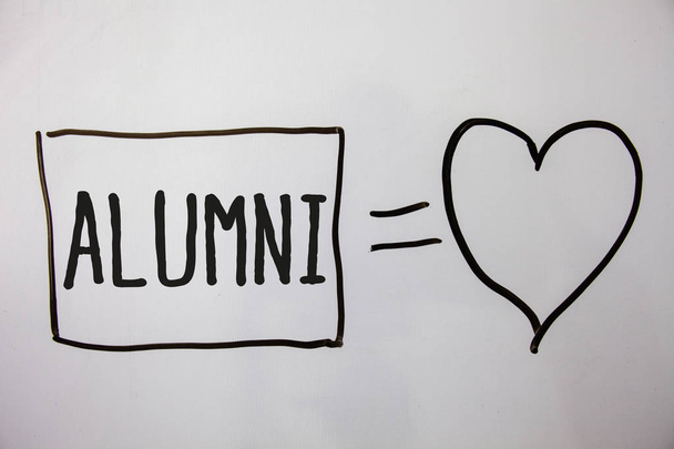 Conceptual hand writing showing Alumni. Business photo showcasing Alum Old graduate Postgraduate Gathering College Academy Celebration Ideas messages heart white background intentions feelings - Foto, immagini