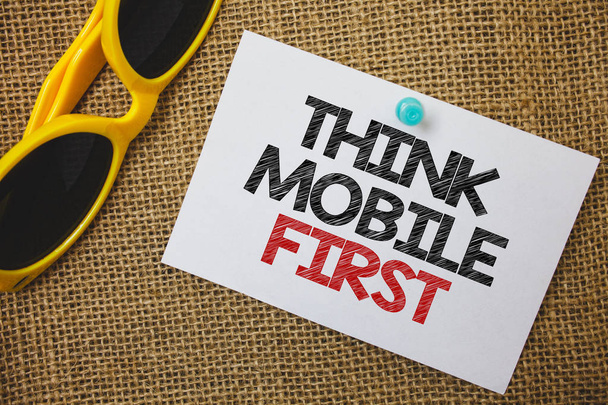 Writing note showing  Think Mobile First. Business photo showcasing Handheld devises marketing target portable phones first Sunglass paper wonderful white background lovely message idea memories - Photo, Image