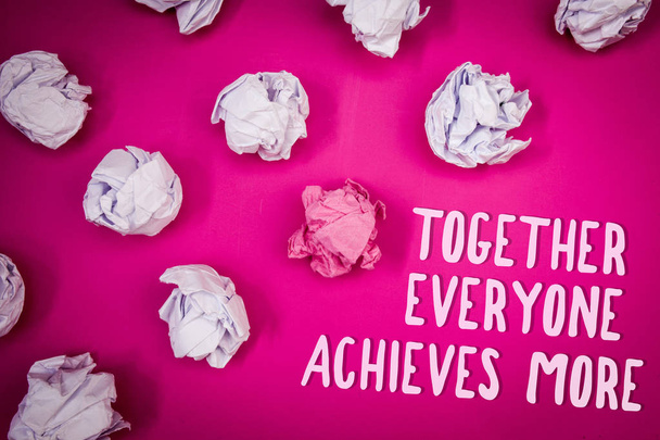Conceptual hand writing showing Together Everyone Achieves More. Business photo text Teamwork Cooperation Attain Acquire Success Ideas pink background crumpled papers trial mistakes several tries - Photo, Image