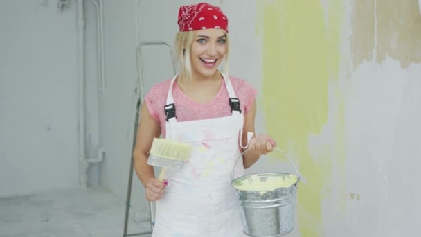 Cheerful woman with brush and paint bucket  - Footage, Video