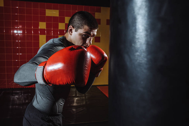 Boxer hits a speed bag in the gym - Фото, зображення