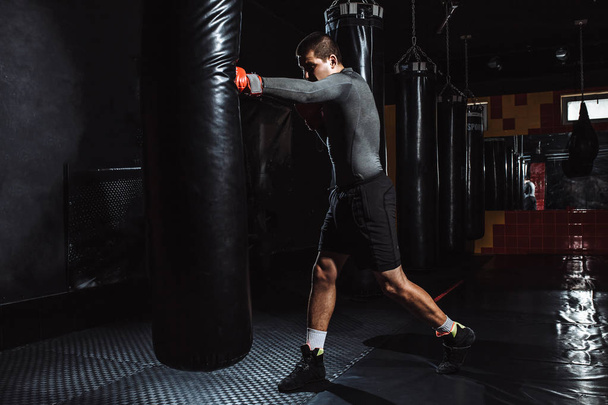 Boxer hits a speed bag in the gym - Fotoğraf, Görsel