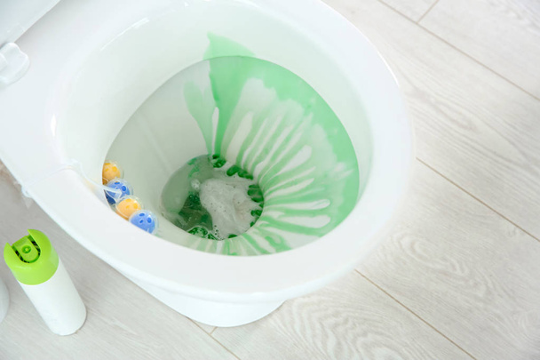Ceramic toilet bowl with detergent in modern bathroom - Photo, Image