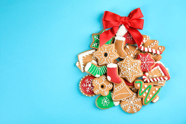 Tasty homemade Christmas cookies on color background, top view - Fotó, kép