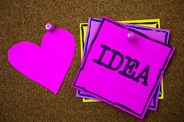 Writing note showing  Idea. Business photo showcasing Creative Innovative Thinking Imagination Design Planning Solutions Papers pink heart cork background ideas love lovely message remember - Photo, Image