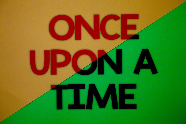 Text sign showing Once Open A Time. Conceptual photo telling story Fairytale story Historical event Novel Yellow green split background message thoughts important information - Photo, Image