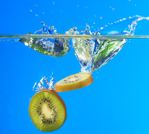 kiwi, kiwi fruit falling into the water - Фото, изображение