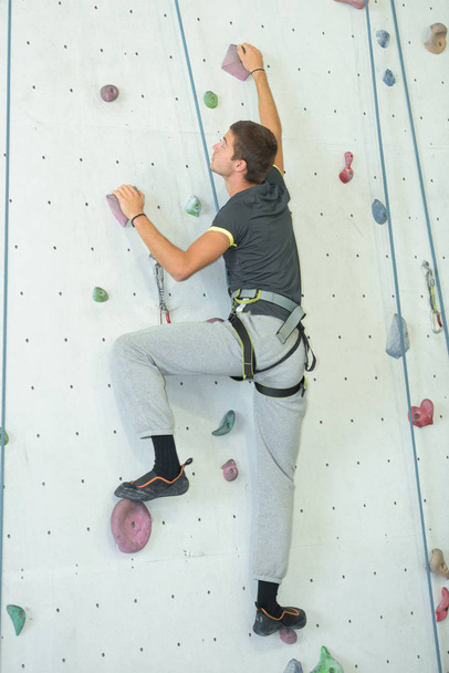 young man wall climbing - Photo, Image