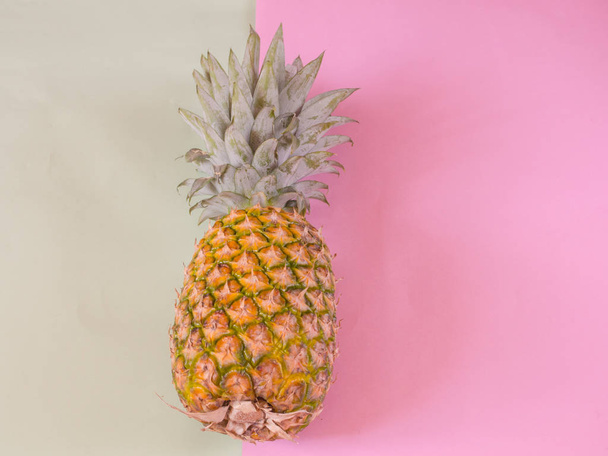 Pineapple on pink and green background with copy space - Photo, image