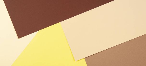 Color papers geometry composition background with brown, beige and yellow tones. - Photo, Image