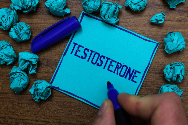 Text sign showing Testosterone. Conceptual photo Male hormones development and stimulation sports substance Cyan paper object thoughts crumpled papers ideas mistakes several tries - Foto, imagen