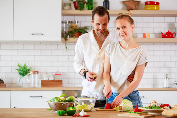 Image of beautiful couple in love preparing breakfast - Valokuva, kuva