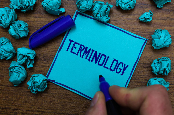 Text sign showing Terminology. Conceptual photo Collection of terms used by different profession study industry Cyan paper object thoughts crumpled papers ideas mistakes several tries - Photo, Image