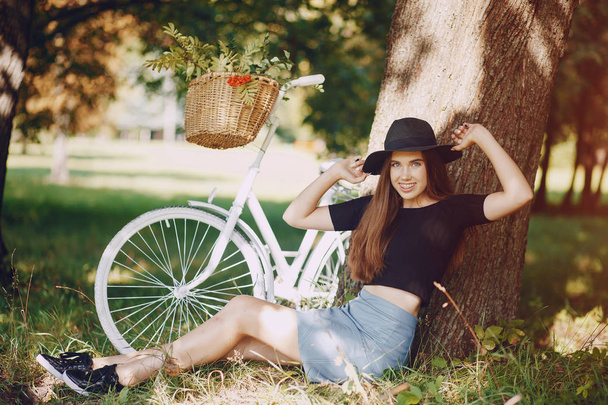 Girl with a bike - Фото, изображение