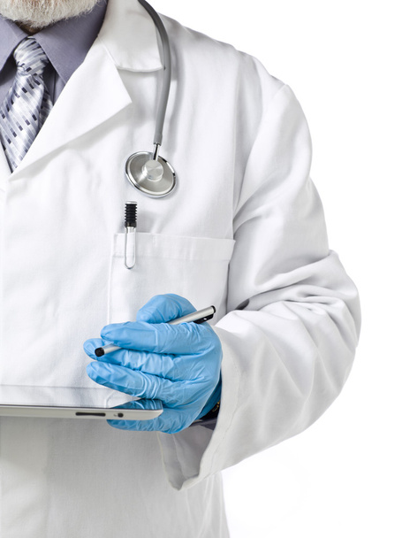 a doctor wearing blue hand glove with tablet - Foto, afbeelding
