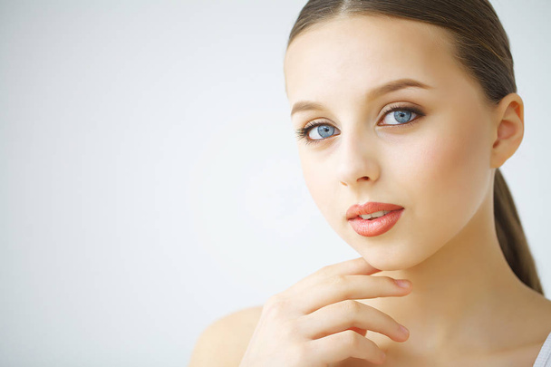 Beauty face of woman with cosmetic cream on face - Foto, Imagem