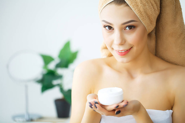 Beauty Face Care. Woman Applying Cream On Skin. - Photo, Image
