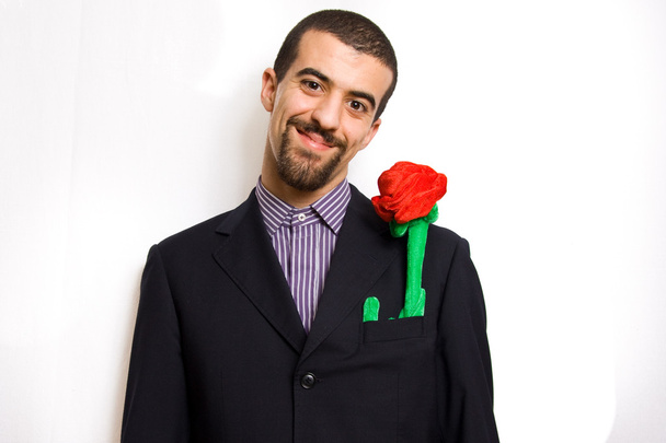 Man presenting a red rose for saint vale - Φωτογραφία, εικόνα