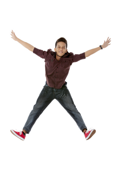 a handsome young man jumping - Photo, Image