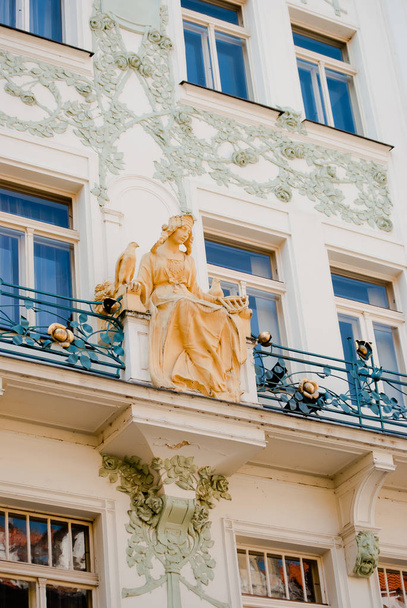 Beautiful balcony and golden statue of the old house in Prague, Czech Republic  - Φωτογραφία, εικόνα