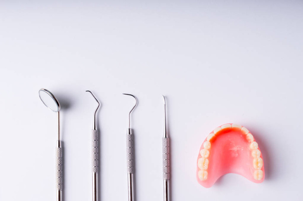 Set of metal Dentist's medical equipment tools, top view - Foto, imagen