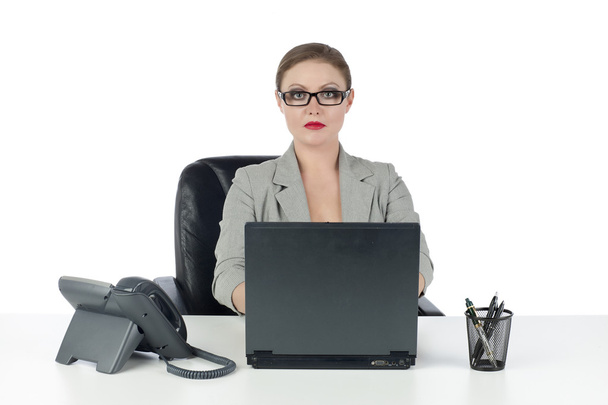 a strict businesswoman sitting on the chair - Photo, Image