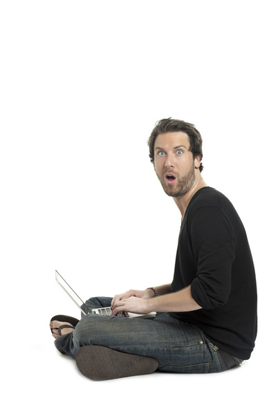 a surprised man using laptop - Φωτογραφία, εικόνα