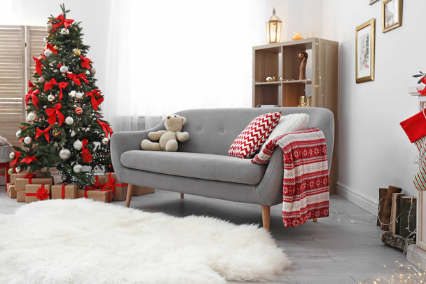 Living room interior with decorated Christmas tree - Fotó, kép