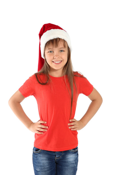 Cute little child in Santa hat on white background. Christmas celebration - Fotoğraf, Görsel
