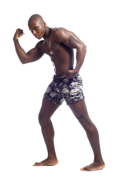 afro-americano homem flexionando músculos
 - Foto, Imagem