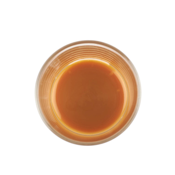 Glass shot of caramel sauce isolated - Fotó, kép