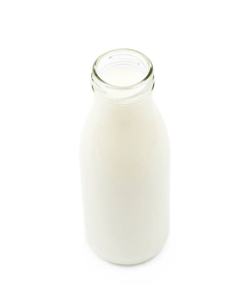 Glass bottle of milk isolated - 写真・画像