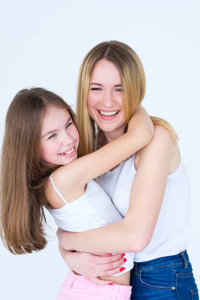 mom daughter hug happy feeling joyful parenting - Foto, imagen