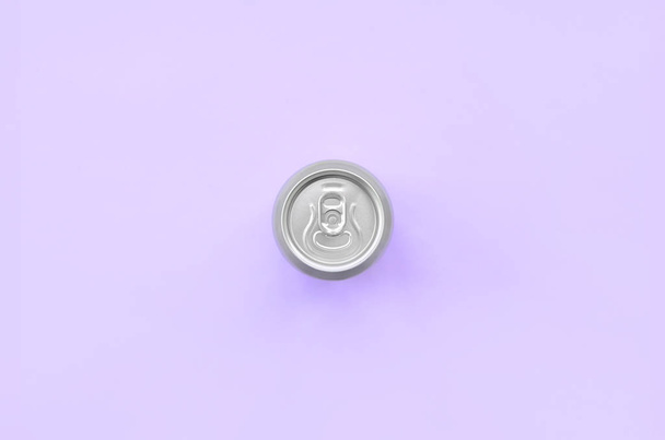 Metallic beer can on texture background of fashion pastel violet color paper in minimal concept. - Photo, Image