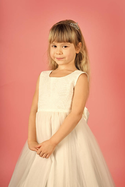 child model. Look, hairdresser, makeup. Child girl in stylish glamour dress, elegance. Fashion and beauty, little princess. Little girl in fashionable dress, prom. Fashion model on pink background - Foto, immagini
