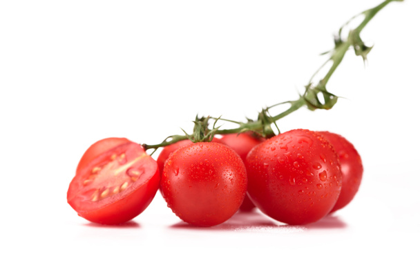 close up view of fresh cherry tomatoes on twig isolated on white - Valokuva, kuva