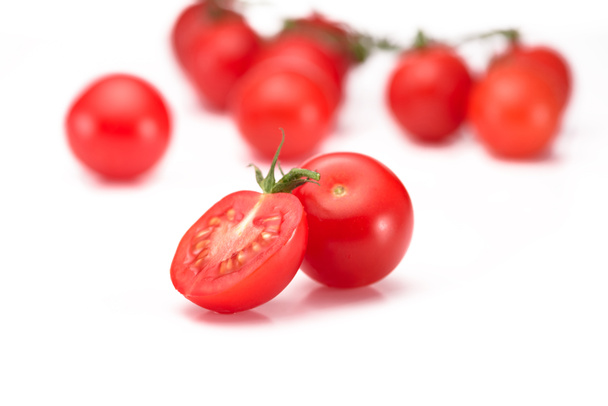 close up view of fresh cherry tomatoes on twig isolated on white - Foto, imagen