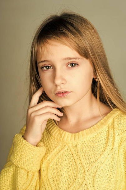 children clothing. Hairdresser, skincare, casual style, denim. Fashion model and beauty look. Beauty or kid fashion with cosmetics and healthy hair. Little girl with long hair - Zdjęcie, obraz