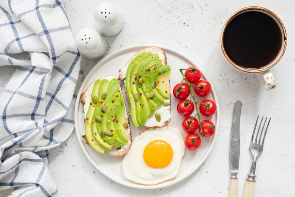 Avocado toast, egg and coffee for breakfast - Foto, Imagem