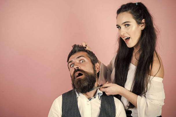 Male hairdresser. Man with beard with lady - Foto, afbeelding