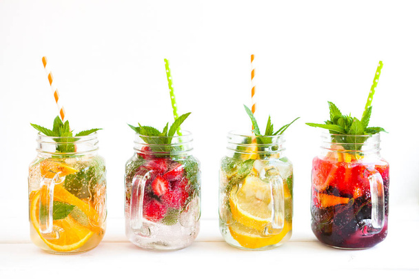 Fresh lemonade with summer fruits and berries on white background - Valokuva, kuva