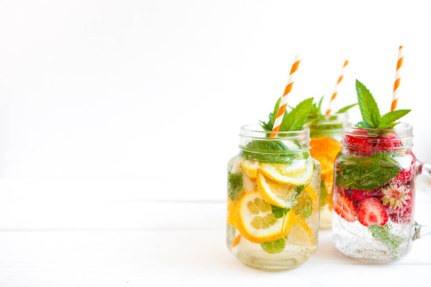 Fresh lemonade with summer fruits and berries on white background - Foto, Imagem