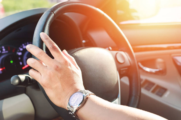 hand wear a watch and drive a car - Φωτογραφία, εικόνα