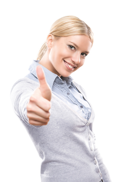 Cute young woman showing thumbs up - Photo, Image