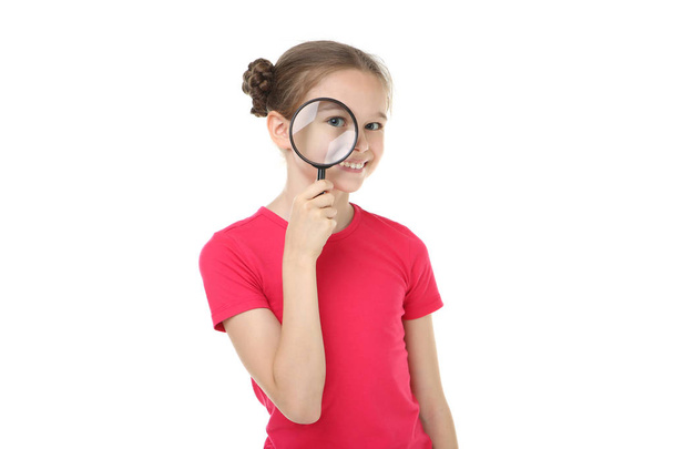 Cute young girl with magnifying glass on white background - Φωτογραφία, εικόνα