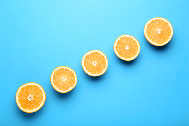 Orange fruit on blue background - Foto, afbeelding