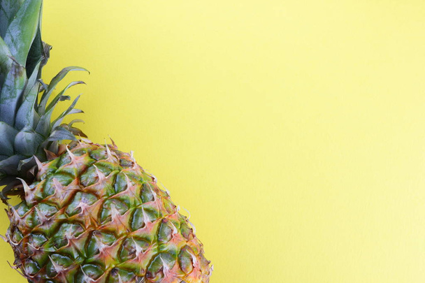 Pineapple on a yellow background, tropical fruit top view, pineapple in pop art style, vegetarian food in minimalism style, copy space - Fotoğraf, Görsel