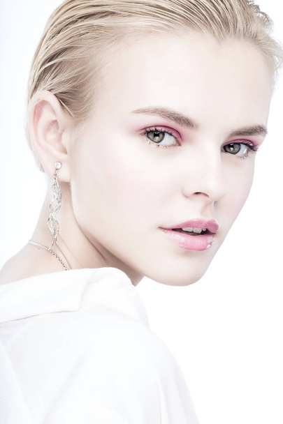Young tender woman with stylish pink makeup and silver earrings  - Foto, Imagem