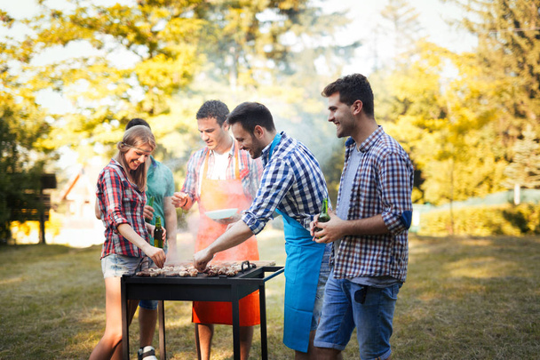 Young people having  bbq party in nature - Fotografie, Obrázek